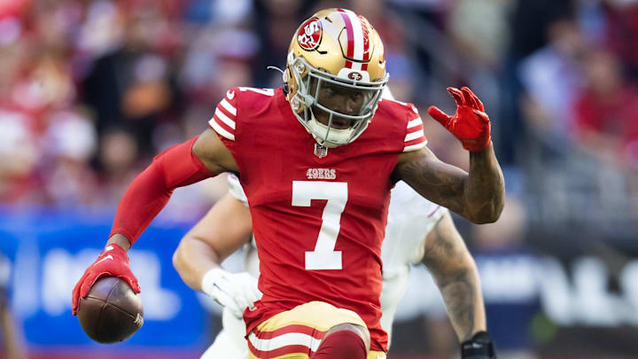 Dec 17, 2023; Glendale, Arizona, USA; San Francisco 49ers cornerback Charvarius Ward (7) runs back an interceptions for a touchdown during the first quarter against the Arizona Cardinals at State Farm Stadium. Mandatory Credit: Mark J. Rebilas-Imagn Images