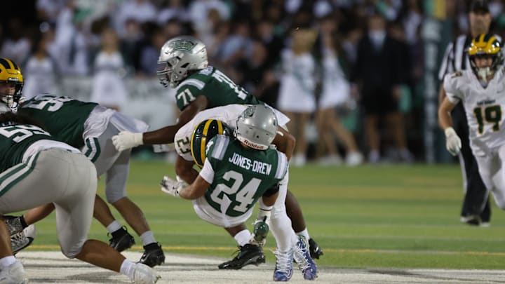 San Ramon Valley linebacker Marco Jones with a big hit on Duece Jones-Drew in Friday's big loss to De La Salle. San Ramon Valley linebacker Marco Jones with a big hit on Duece Jones-Drew in Friday's big loss to De La Salle.