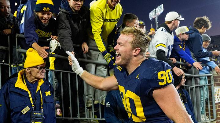 Michigan defensive end John Henry Daley (90) shakes hands with fans as they celebrate 21-18 win over Penn State at Michigan Stadium in Ann Arbor on Saturday, Oct. 17, 2026. Michigan defensive end John Henry Daley (90) shakes hands with fans as they celebrate 21-18 win over Penn State at Michigan Stadium in Ann Arbor on Saturday, Oct. 17, 2026.