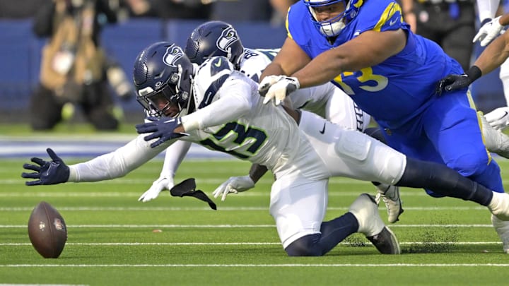 Seattle Seahawks linebacker Ernest Jones IV beats Los Angeles Rams guard Steve Avila to the ball.