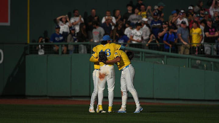 Jul 26, 2025; Boston, Massachusetts, USA; Boston Red Sox left fielder Jarren Duran (16) center fielder Ceddanne Rafaela (3) and right fielder Roman Anthony (19) react after deleting the Los Angeles Dodgers at Fenway Park. Mandatory Credit: Bob DeChiara-Imagn Images