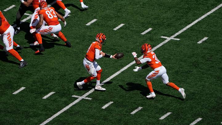 Cincinnati Bengals quarterback Joe Burrow hands the ball off to running back Chase Brown against the Tampa Bay Buccaneers on Sunday, Sept. 13. Cincinnati Bengals quarterback Joe Burrow hands the ball off to running back Chase Brown against the Tampa Bay Buccaneers on Sunday, Sept. 13.