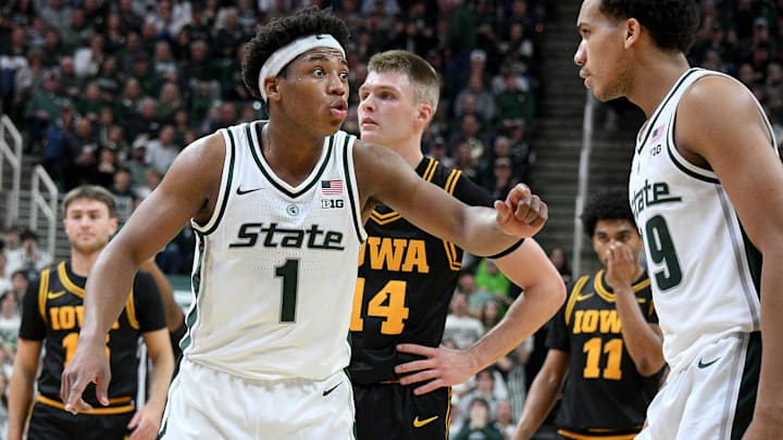 Dec 2, 2025; East Lansing, Michigan, USA;  Michigan State Spartans guard Jeremy Fears Jr. (1) instructs teammate Michigan State Spartans guard Divine Ugochukwu (99) during the first half against the Iowa Hawkeyes at Jack Breslin Student Events Center. Mandatory Credit: Dale Young-Imagn Images