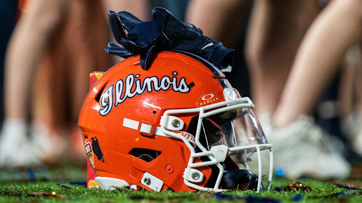 Dec 31, 2024; Orlando, FL, USA; A Illinois Fighting Illini helmet sitting on confetti after the game against the South Carolina Gamecocks at Camping World Stadium. Mandatory Credit: Jeremy Reper-Imagn Images Dec 31, 2024; Orlando, FL, USA; A Illinois Fighting Illini helmet sitting on confetti after the game against the South Carolina Gamecocks at Camping World Stadium. Mandatory Credit: Jeremy Reper-Imagn Images