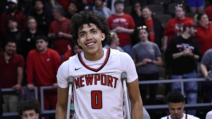 Newport's Taylen Kinney reacts after Newport's Ninth Region championship win over Cooper Tuesday, March 12, 2024. Kinney was injured in the first half.