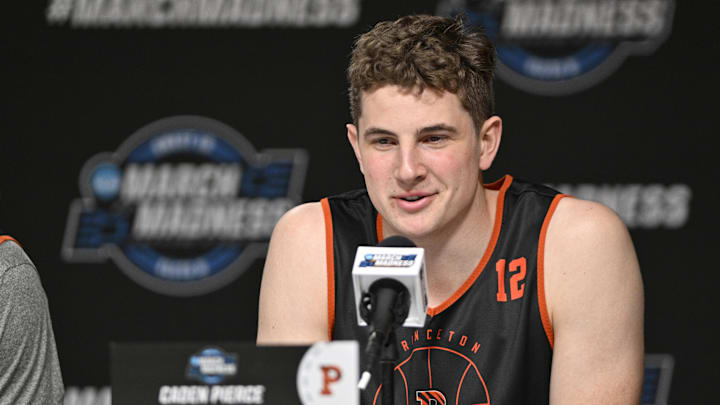 Princeton Tigers forward Caden Pierce (12) answers a question. Princeton Tigers forward Caden Pierce (12) answers a question.