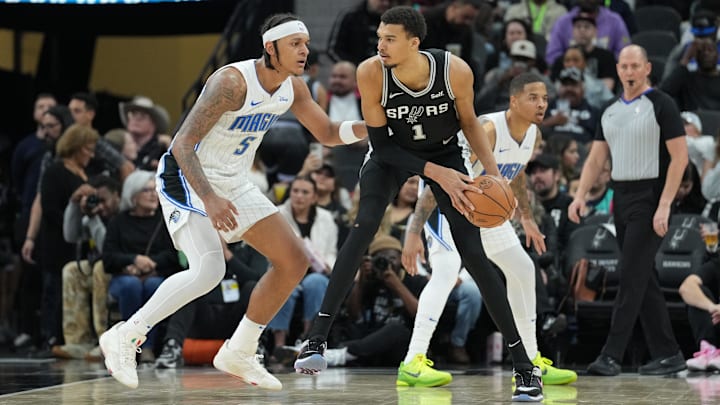 San Antonio Spurs center Victor Wembanyama and Orlando Magic forward Paolo Banchero both took shots in the final minute to help decide the most recent meeting at Kia Center between their teams, but neither will be on the floor for their Dec. 3 matchup.