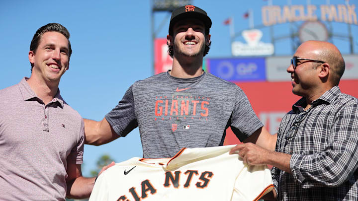 Jul 26, 2023; San Francisco, California, USA; San Francisco Giants general manager Pete Putila, first round draft pick Bryce Eldridge, and president of baseball operations Farhan Zaidi pose for a photo before the game against the Oakland Athletics at Oracle Park.