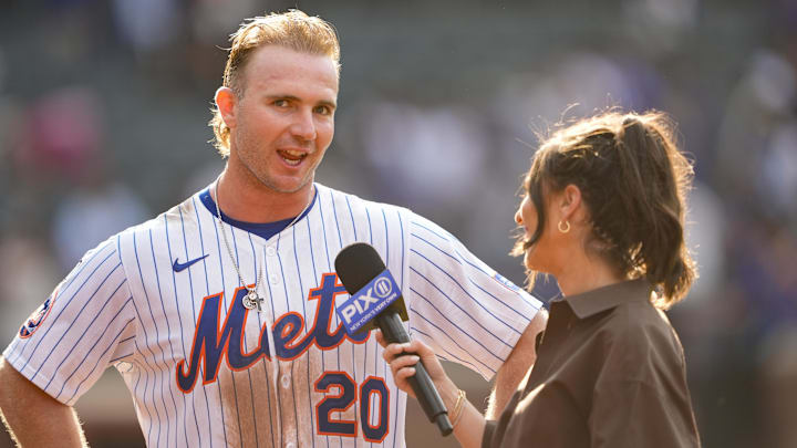 Sep 14, 2025; New York City, New York, USA; New York Mets first baseman Pete Alonso (20) conducts an interview after hitting a walk off three run home run against the Texas Rangers during the tenth inning at Citi Field. Mandatory Credit: Gregory Fisher-Imagn Images