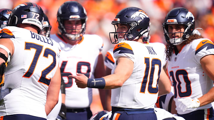 Sep 15, 2024; Denver, Colorado, USA; Denver Broncos quarterback Bo Nix (10) huddles with teammates in the first quarter against the Pittsburgh Steelers at Empower Field at Mile High. 
