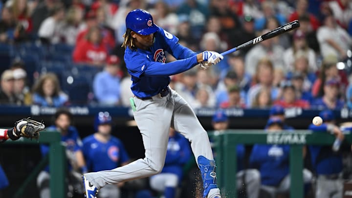 Sep 25, 2024; Philadelphia, Pennsylvania, USA; Chicago Cubs outfielder Kevin Alcantara (13) hits an infield single against the Philadelphia Phillies in the ninth inning at Citizens Bank Park.