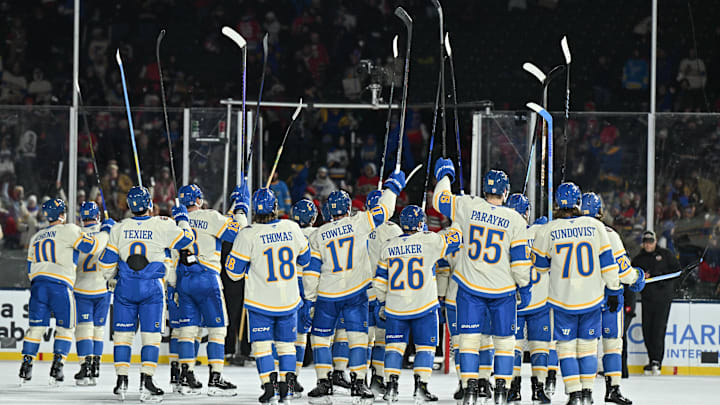 Dec 31, 2024; Chicago, Illinois, USA; The St. Louis Blues thank fans after the Winter Classic against the Chicago Blackhawks at Wrigley Field. Mandatory Credit: Daniel Bartel-Imagn Images