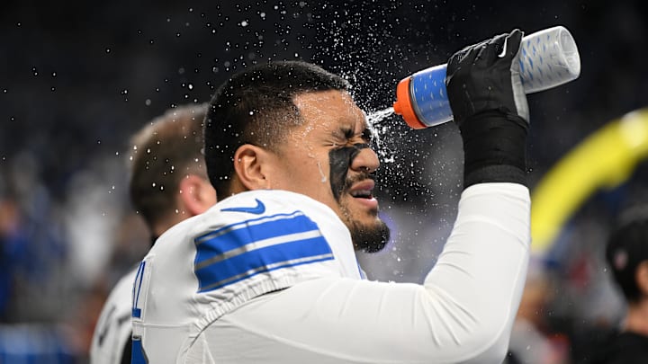 Dec 4, 2025; Detroit, Michigan, USA; Detroit Lions offensive tackle Penei Sewell (58) sprays water on his face before a game against the Dallas Cowboys at Ford Field. Mandatory Credit: Lon Horwedel-Imagn Images