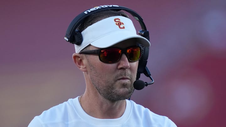 Oct 21, 2023; Los Angeles, California, USA; Southern California Trojans head coach Lincoln Riley watches from the sidelines against the Utah Utes in the first half at United Airlines Field at Los Angeles Memorial Coliseum. Mandatory Credit: Kirby Lee-Imagn Images