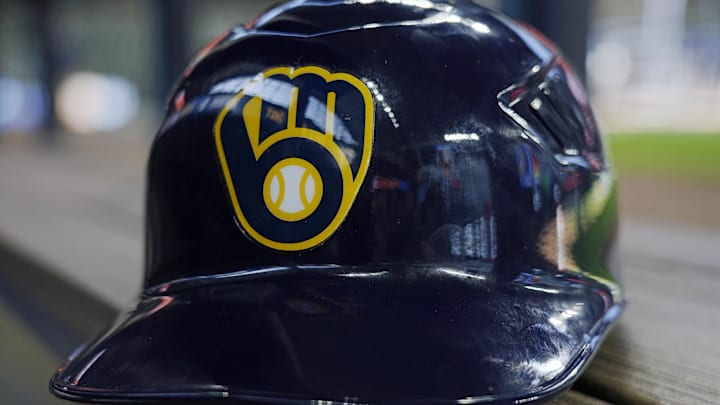 Jun 10, 2024; Milwaukee, Wisconsin, USA;  A Milwaukee Brewers batting helmet sits on the bench during batting practice prior to the game against the Toronto Blue Jays at American Family Field. Mandatory Credit: Jeff Hanisch-Imagn Images