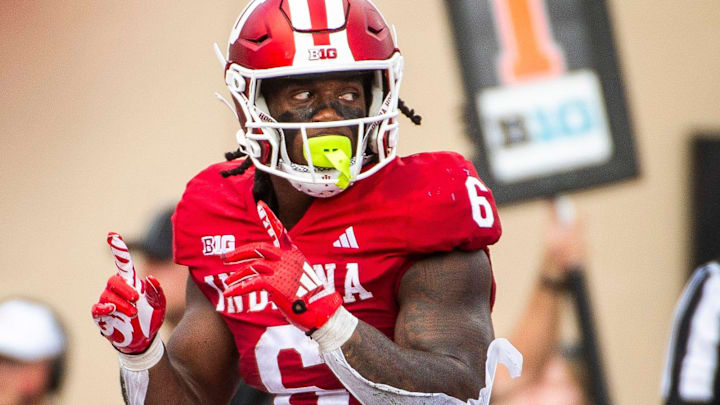 Indiana's Justice Ellison (6) celebrates a touchdown against Charlotte at Memorial Stadium.