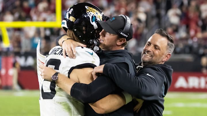 Nov 23, 2025; Glendale, Arizona, USA; Jacksonville Jaguars quarterback Trevor Lawrence (16) celebrates with head coach Liam Coen after defeating the Arizona Cardinals at State Farm Stadium. Mandatory Credit: Mark J. Rebilas-Imagn Images