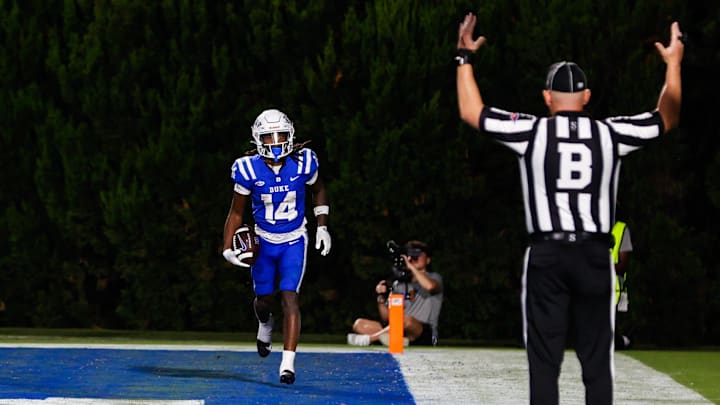 Sep 14, 2024; Durham, North Carolina, USA; Duke Blue Devils wide receiver Que'Sean Brown (14) celebrates a touchdown during the second half of the game against the UConn Huskies.