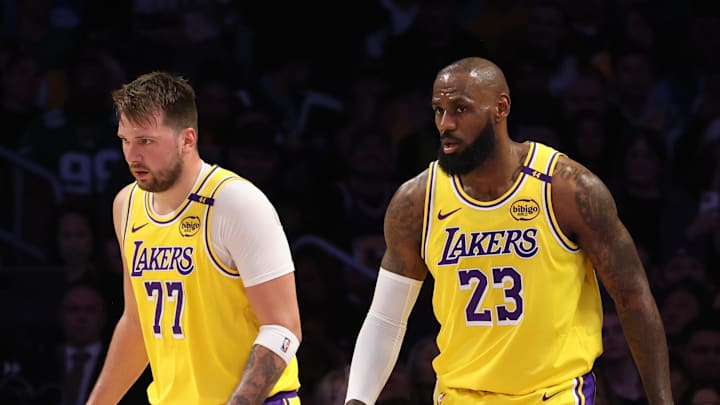 Feb 19, 2025; Los Angeles, California, USA; Los Angeles Lakers forward LeBron James (23) and guard Luka Doncic (77) during the first quarter against the Charlotte Hornets at Crypto.com Arena. Mandatory Credit: Jason Parkhurst-Imagn Images