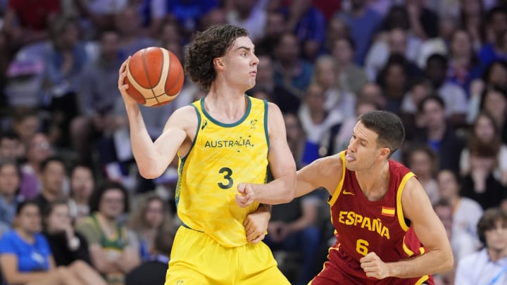 Jul 27, 2024; Villeneuve-d'Ascq, France; Australia guard Josh Giddey (3) is defended by Spain forward Xabi Lopez-Arostegui (6) in men's Group A play during the Paris 2024 Olympic Summer Games at Stade Pierre-Mauroy. Jul 27, 2024; Villeneuve-d'Ascq, France; Australia guard Josh Giddey (3) is defended by Spain forward Xabi Lopez-Arostegui (6) in men's Group A play during the Paris 2024 Olympic Summer Games at Stade Pierre-Mauroy.
