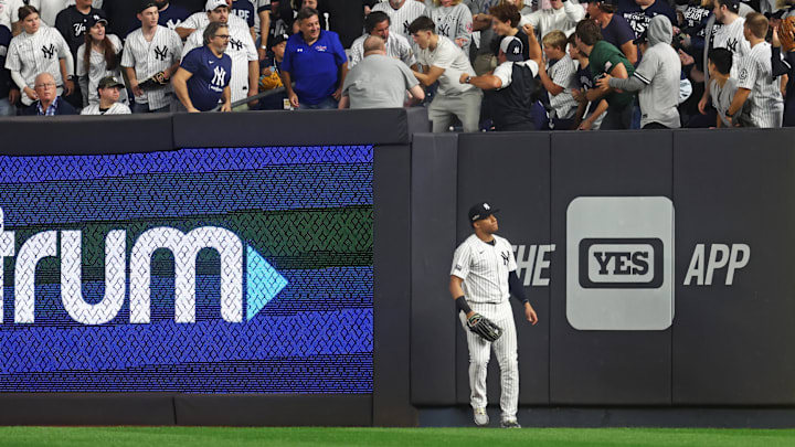 Oct 5, 2024; Bronx, New York, USA; New York Yankees outfielder Juan Soto (22) is unable to catch a homer by Kansas City Royals outfielder MJ Melendez (1) during the fourth inning during game one of the ALDS for the 2024 MLB Playoffs at Yankee Stadium. Mandatory Credit: Vincent Carchietta-Imagn Images