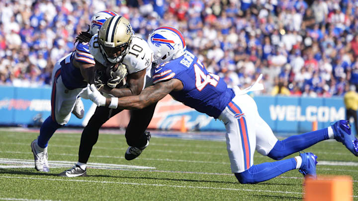 Sep 28, 2025; Orchard Park, New York, USA; New Orleans Saints wide receiver Brandin Cooks (10) is tackled by Buffalo Bills cornerback Christian Benford (47) and linebacker Dorian Williams (42) during the fourth quarter at Highmark Stadium. Mandatory Credit: Gregory Fisher-Imagn Images Sep 28, 2025; Orchard Park, New York, USA; New Orleans Saints wide receiver Brandin Cooks (10) is tackled by Buffalo Bills cornerback Christian Benford (47) and linebacker Dorian Williams (42) during the fourth quarter at Highmark Stadium. Mandatory Credit: Gregory Fisher-Imagn Images