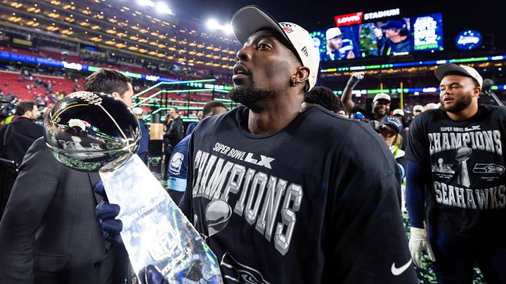 Seattle Seahawks defensive end DeMarcus Lawrence (0) celebrates with the Vince Lombardi Trophy after defeating the New England Patriots. Seattle Seahawks defensive end DeMarcus Lawrence (0) celebrates with the Vince Lombardi Trophy after defeating the New England Patriots.