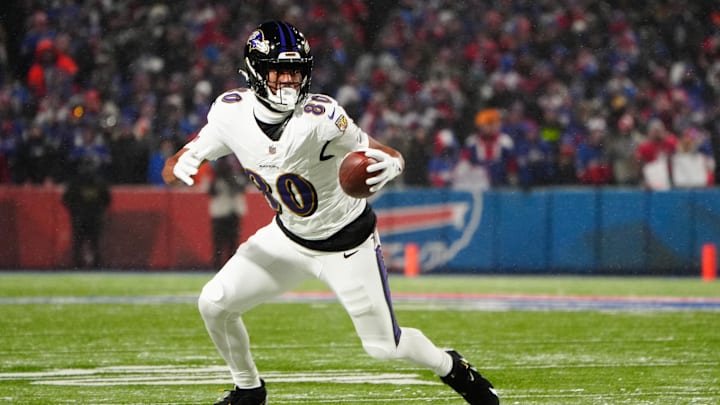 Jan 19, 2025; Orchard Park, New York, USA; Baltimore Ravens tight end Isaiah Likely (80) runs the ball after making a catch during the first quarter against the Buffalo Bills in a 2025 AFC divisional round game at Highmark Stadium. Mandatory Credit: Gregory Fisher-Imagn Images