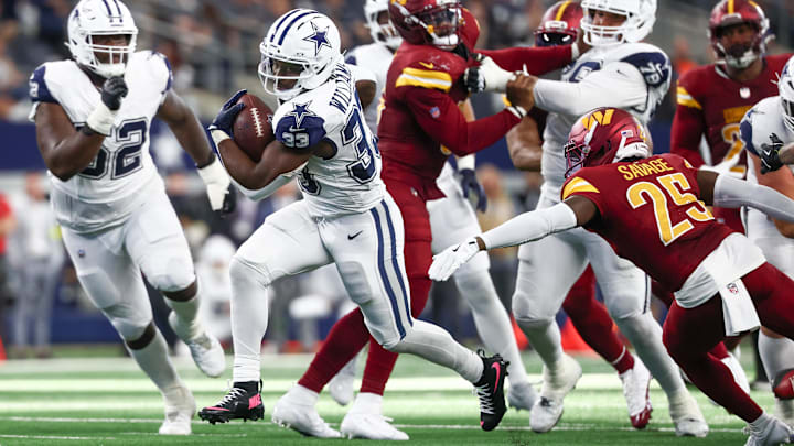 Dallas Cowboys running back Javonte Williams carries the ball against the Washington Commanders. Dallas Cowboys running back Javonte Williams carries the ball against the Washington Commanders.