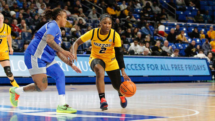 Dec. 14, 2025; St. Louis, Missouri, USA; Missouri Tigers guard Saniah Taylor (2) looks to dribble toward the basket while defended by a Saint Louis Billikens player at Chaifetz Arena.
