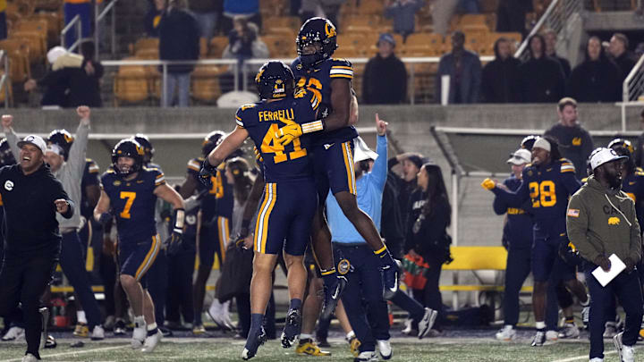 Nov 29, 2025; Berkeley, California, USA; California Golden Bears linebacker Luke Ferrelli (41) and linebacker Aaron Hampton (center right) celebrate after a missed field goal by the Southern Methodist Mustangs during the fourth quarter at California Memorial Stadium. Mandatory Credit: Darren Yamashita-Imagn Images