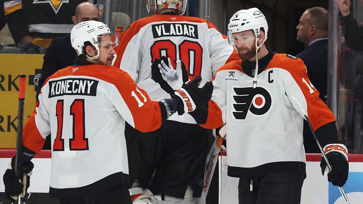 Apr 20, 2026; Pittsburgh, Pennsylvania, USA;  Philadelphia Flyers right wing Travis Konecny (11) and center Sean Couturier (14) celebrate after defeating the Pittsburgh Penguins in game two of the first round of the 2026 Stanley Cup Playoffs at PPG Paints Arena.