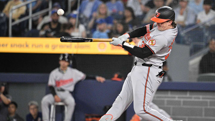  Jun 5, 2024; Toronto, Ontario, CAN;   Baltimore Orioles catcher Adley Rutschman (35) hits a single against the Toronto Blue Jays in the first inning at Rogers Centre. Mandatory Credit: Dan Hamilton-USA TODAY Sports 