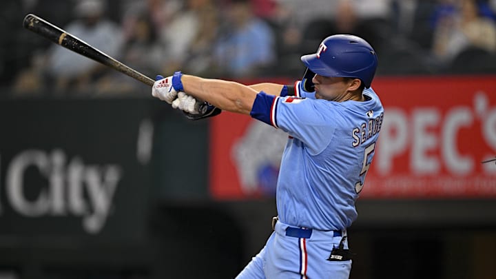 Apr 20, 2025; Arlington, Texas, USA; Texas Rangers shortstop Corey Seager (5) bats during the game between the Texas Rangers and the Los Angeles Dodgers at Globe Life Field. 