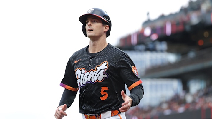 Jul 8, 2025; San Francisco, California, USA; San Francisco Giants right fielder Mike Yastrzemski (5) jogs to the dugout after scoring a run against the Philadelphia Phillies during the second inning at Oracle Park. Mandatory Credit: Kelley L Cox-Imagn Images