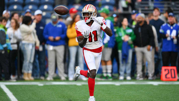 Oct 10, 2024; Seattle, Washington, USA; San Francisco 49ers wide receiver Brandon Aiyuk (11) catches the ball during warmups before the game against the Seattle Seahawks at Lumen Field. Mandatory Credit: Steven Bisig-Imagn Images