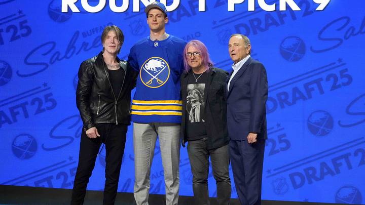 Jun 27, 2025; Los Angeles, California, USA; Radim Mrtka (second from left) poses with John Rzeznik (left) and Robby Takac (second from right) of the Goo Goo Dolls and NHL commissioner Gary Bettman (right) after being selected  as the ninth overall pick to the Buffalo Sabres in the first round of the 2025 NHL Draft at Peacock Theater. Mandatory Credit: Kirby Lee-Imagn Images