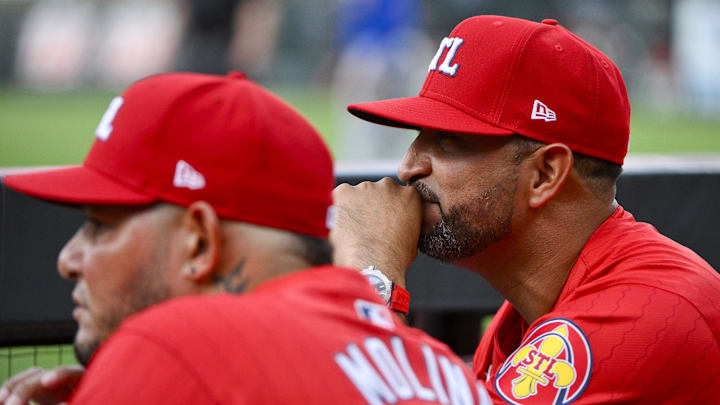 Aug 8, 2025; St. Louis, Missouri, USA; St. Louis Cardinals manager Oliver Marmol (37) and guest coach Yadier Molina (4) look on from the dugout before a game against the Chicago Cubs at Busch Stadium. Mandatory Credit: Jeff Curry-Imagn Images Aug 8, 2025; St. Louis, Missouri, USA; St. Louis Cardinals manager Oliver Marmol (37) and guest coach Yadier Molina (4) look on from the dugout before a game against the Chicago Cubs at Busch Stadium. Mandatory Credit: Jeff Curry-Imagn Images