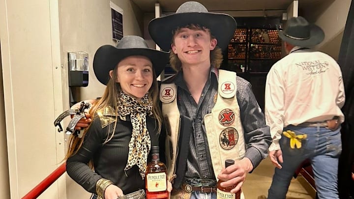 Amanda Wisehart and Hayden Welsh posing after a big win at Colorado vs. the World at the National Western Stock Show and Rodeo in Denver, Colorado