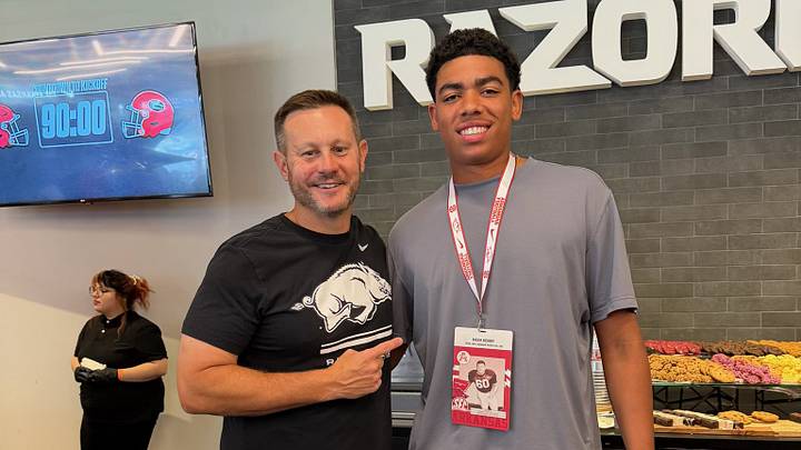 Arkansas Razorbacks 2028 4-star quarterback target Nash Henry (right) with coach Ryan Silverfield (left) during his gameday visit on Sept. 19, 2026. Arkansas Razorbacks 2028 4-star quarterback target Nash Henry (right) with coach Ryan Silverfield (left) during his gameday visit on Sept. 19, 2026.