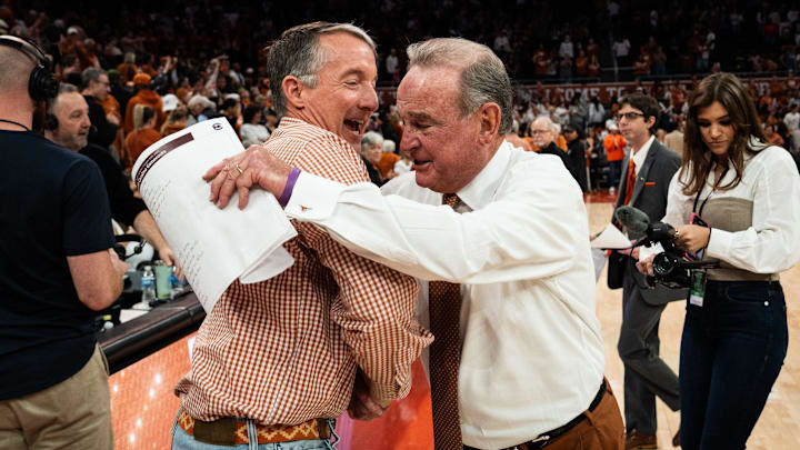Texas Longhorns head coach Vic Schaefer embraces University of Texas President Jay Hartzell after Texas beat the South Carolina Gamecocks 66-62 at home in Austin at the Moody Center, Feb. 9, 2025.