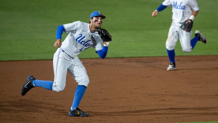 UCLA Bruins infielder Kyle Karros (44) grabs a bouncing ground ball as Auburn Tigers take on UCLA Bruins during the NCAA regional baseball tournament at Plainsman Park in Auburn, Ala., on Sunday, June 5, 2022.