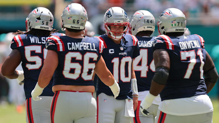 Sep 14, 2025; Miami Gardens, Florida, USA; New England Patriots quarterback Drake Maye (10) shake hands with New England Patriots offensive tackle Will Campbell (66) before the game against the Miami Dolphins at Hard Rock Stadium. Mandatory Credit: Sam Navarro-Imagn Images