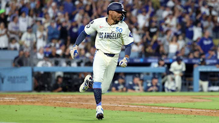 Aug 9, 2025; Los Angeles, California, USA; Los Angeles Dodgers shortstop Mookie Betts (50) hits a RBI single during the sixth inning against the Toronto Blue Jays at Dodger Stadium. Mandatory Credit: Kiyoshi Mio-Imagn Images Aug 9, 2025; Los Angeles, California, USA; Los Angeles Dodgers shortstop Mookie Betts (50) hits a RBI single during the sixth inning against the Toronto Blue Jays at Dodger Stadium. Mandatory Credit: Kiyoshi Mio-Imagn Images