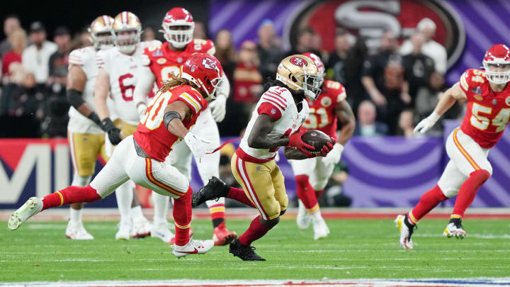 Feb 11, 2024; Paradise, Nevada, USA; San Francisco 49ers wide receiver Brandon Aiyuk (11) runs with the ball against Kansas City Chiefs safety Justin Reid (20) during the first quarter of Super Bowl LVIII at Allegiant Stadium. Mandatory Credit: Kirby Lee-USA TODAY Sports