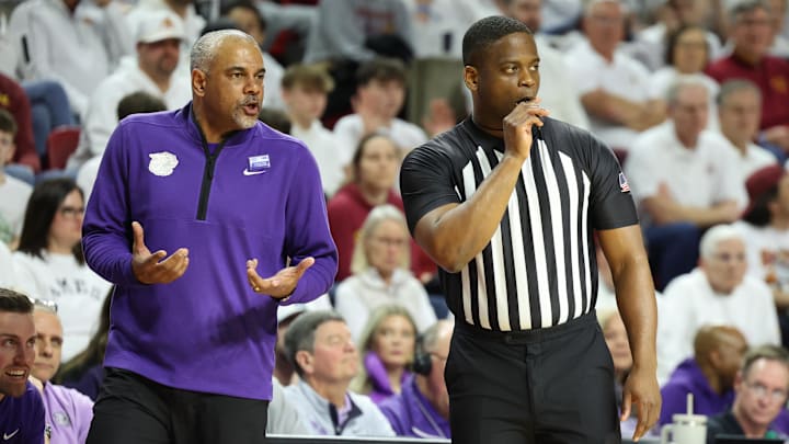 Feb 1, 2025; Ames, Iowa, USA;  Kansas State Wildcats head coach Jerome Tang talks to officials while his team plays the Iowa State Cyclones during the first half at James H. Hilton Coliseum. 