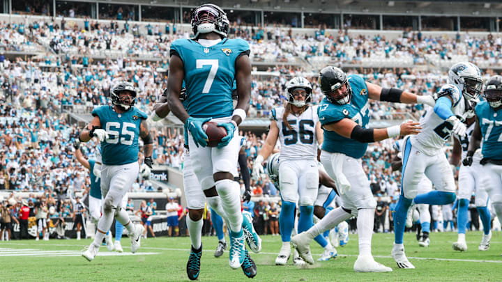 Sep 7, 2025; Jacksonville, Florida, USA; Jacksonville Jaguars wide receiver Brian Thomas Jr. (7) reacts after scoring on a 9-yard touchdown run against the Carolina Panthers during the first half at EverBank Stadium. Mandatory Credit: Nathan Ray Seebeck-Imagn Images
