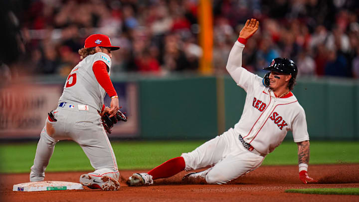 May 12, 2026; Boston, Massachusetts, USA; Boston Red Sox left fielder Jarren Duran (16) safe at second base against Philadelphia Phillies second baseman Bryson Stott (5) in the eighth inning at Fenway Park. Mandatory Credit: David Butler II-Imagn Images