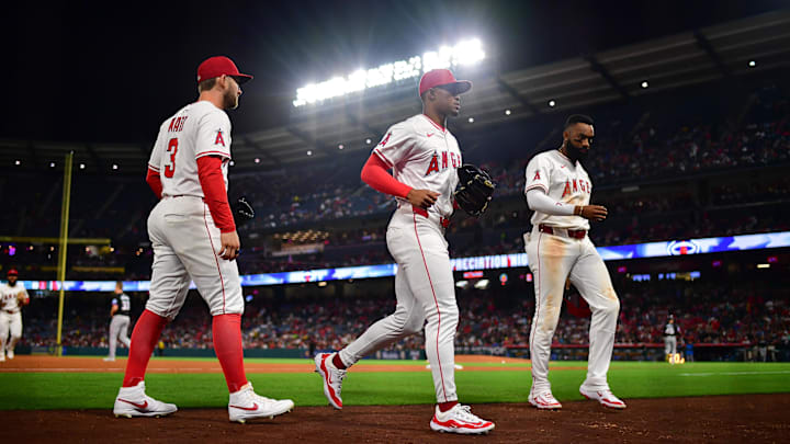 May 24, 2025; Anaheim, California, USA; Los Angeles Angels left fielder Taylor Ward (3) center fielder Kyren Paris (19) and right fielder Jo Adell (7) following the top of the fifth inning against the Miami Marlins at Angel Stadium. Mandatory Credit: Gary A. Vasquez-Imagn Images