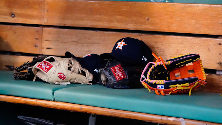 May 16, 2022; Boston, Massachusetts, USA;  A general view of gloves and Houston Astros hats prior to the game against the Boston Red Sox at Fenway Park. 